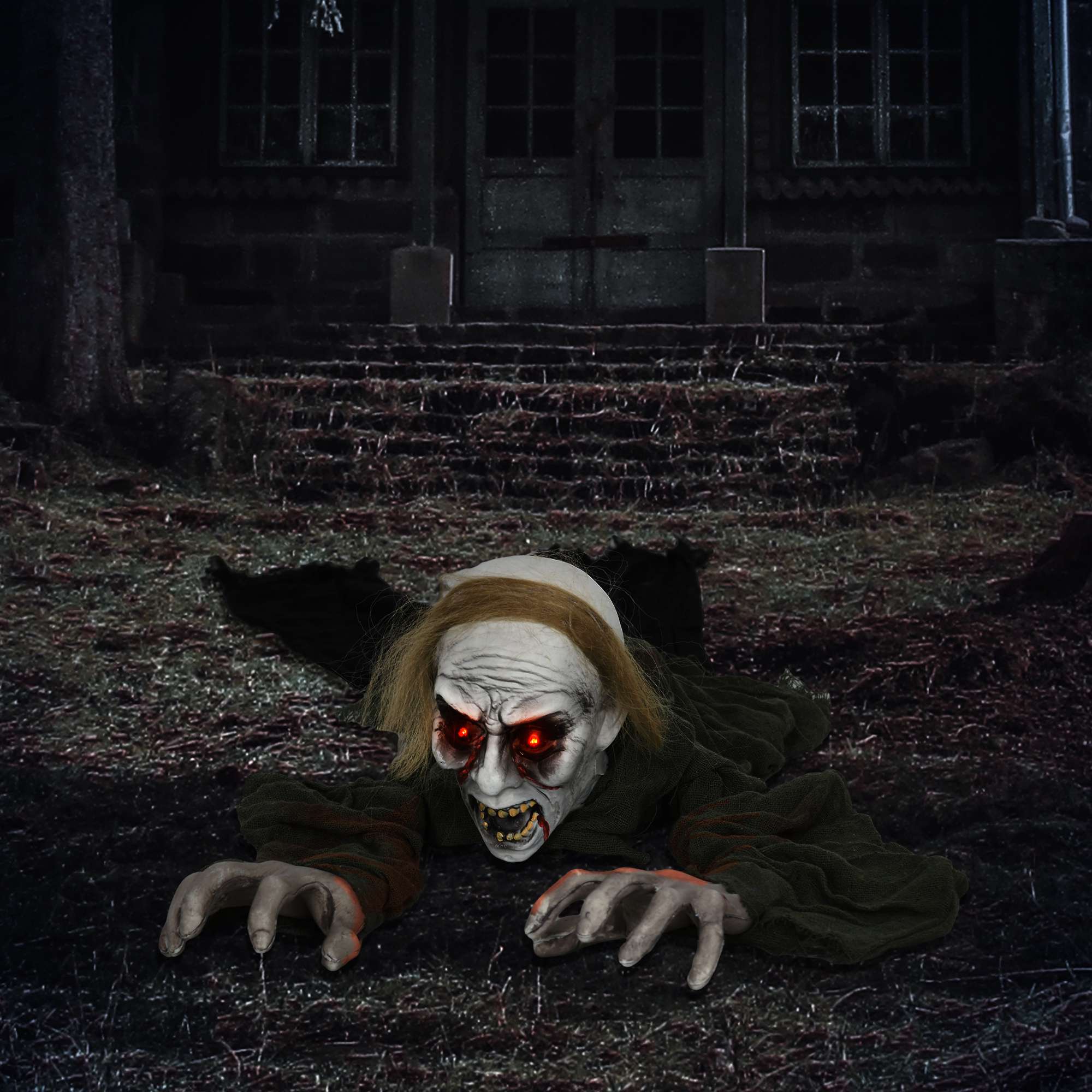 Krypande zombie Halloweendekoration med glödande ögon